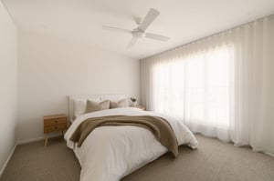 AUSMAR client bedroom: soft light through sheer curtains, crisp wAUSMAR client bedroom: soft light through sheer curtains, crisp white linens.hite linens.
