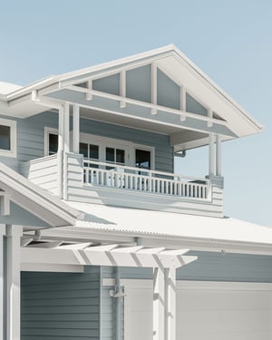 Light blue Hamptons style home facade by AUSMAR, with white trim and gable